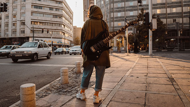 an iranian woman with a guitar