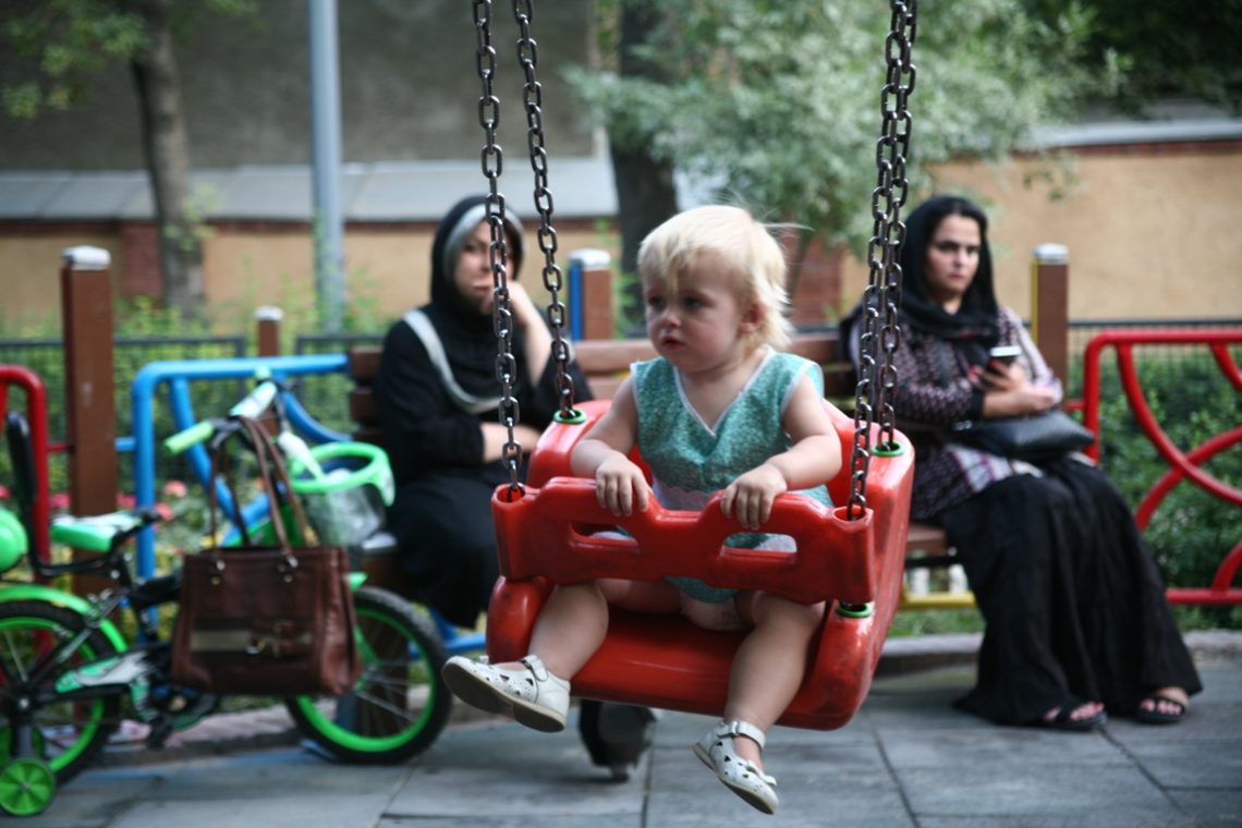 a child is playing in the park in Iran