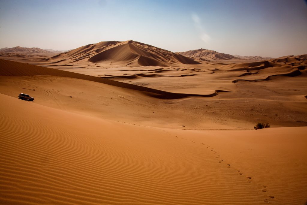 Car driving in Rub-Al-Khali desert, Oman