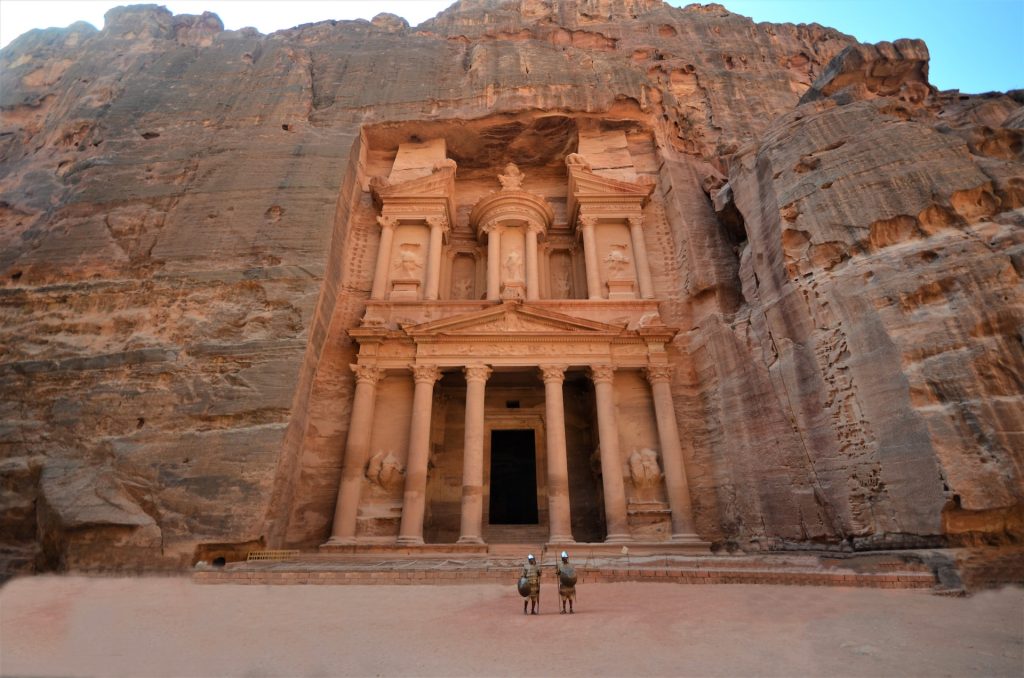 Two soldiers standing in front of the treasury in Petra ancient city, Jordan