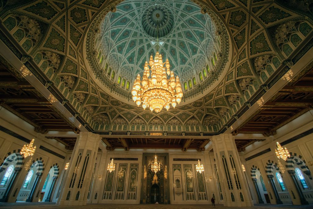 Large chandelier hanging from the prayer hall of Sultan Qaboos Grand Mosque in Muscat, Oman.