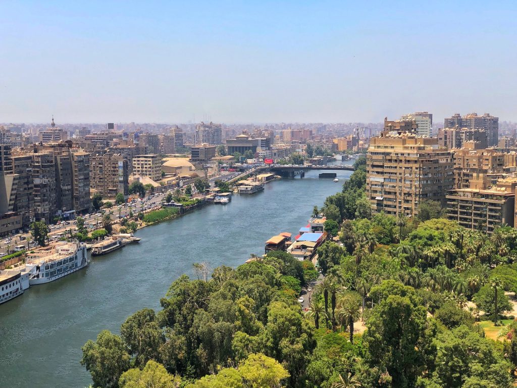 A view of the Nile river with buildings surrounding it