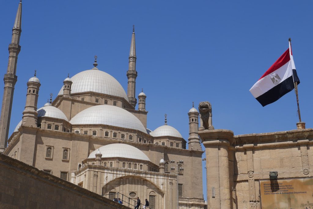 Egyptian flag in front of a mosque in Cairo
